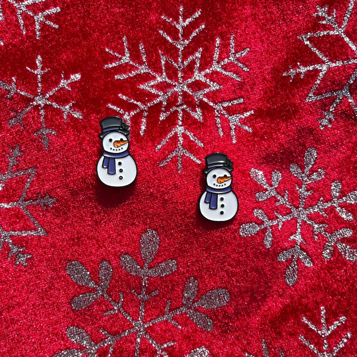 pisnickety snowman horse show number pins on a red background with a snowflake pattern