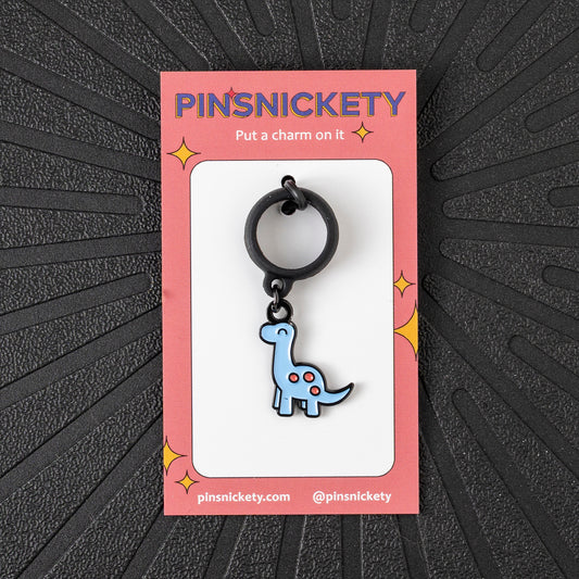 Pinsnickety Brontosaurus crop charm in front of a black background
