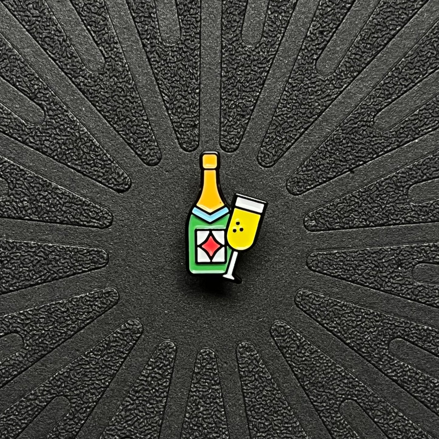 pinsnickety champagne horse show number pin alone on a black background