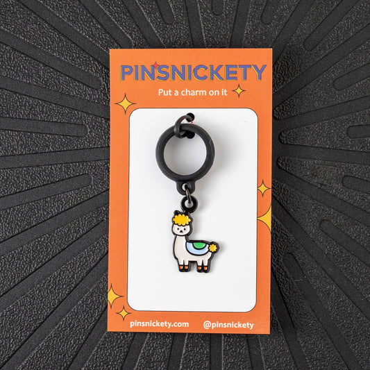 Pinsnickety Drama llama crop charm in front of a black background