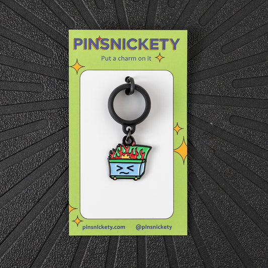 Pinsnickety Dumpster Fire crop charm in front of a black background
