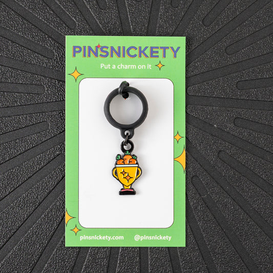 Pinsnickety Trophy crop charm in front of a black background