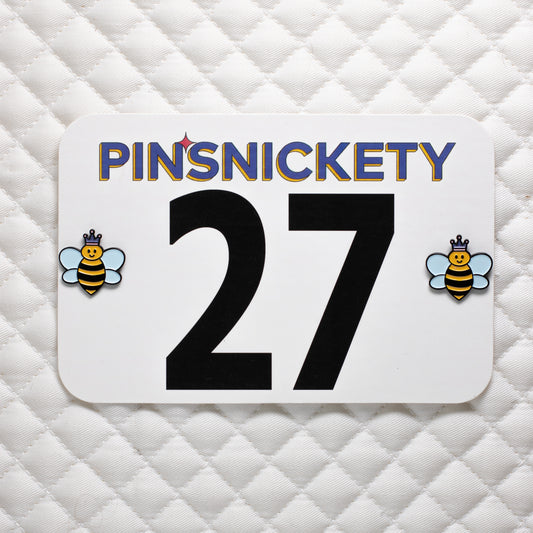 pinsnickety queen bee horse show number pins on a saddle pad