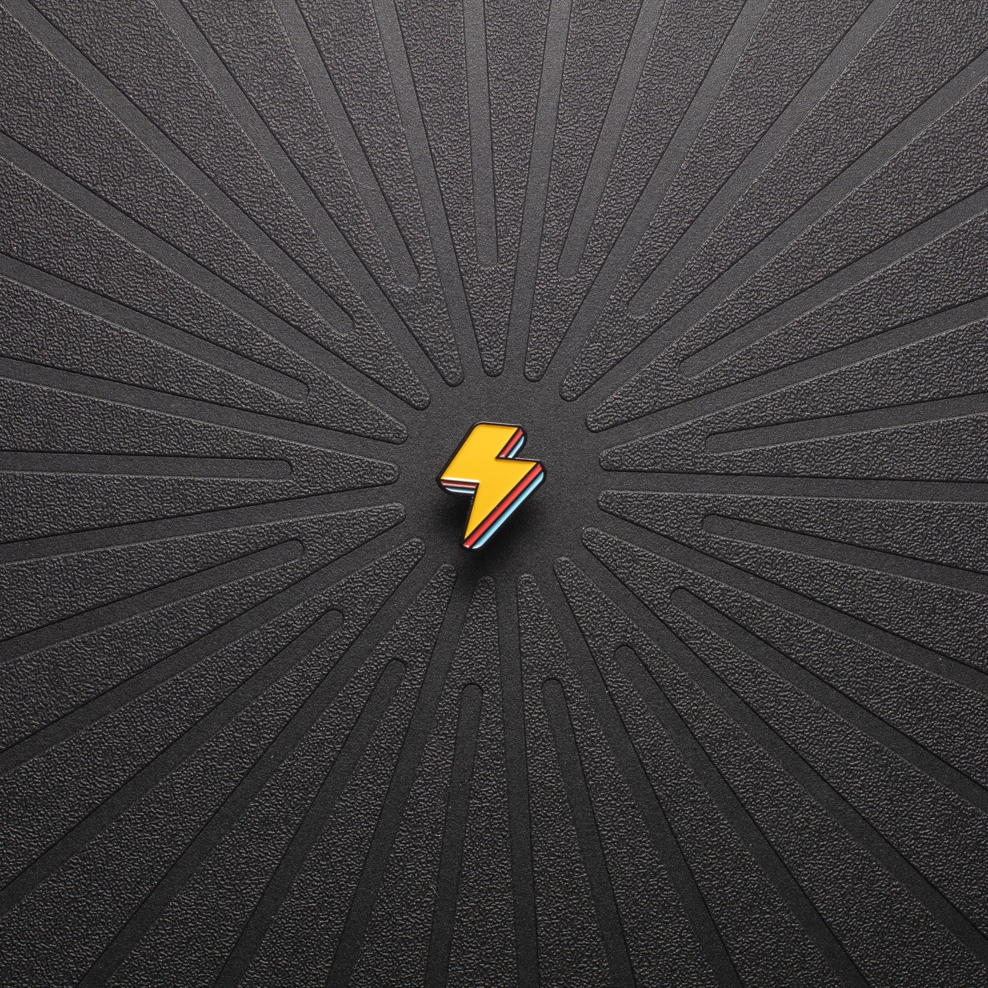 pinsnickety lightning bolt horse show number pin in special edition electric yellow alone on a black background