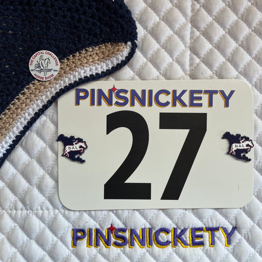 pinsnickety custom capital challenge horse show number pins on a jumper bonnet and custom North american league nal pins on a saddle pad