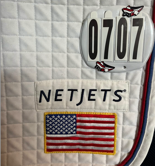 pinsnickety stars and stripes horse show number pins on a u.s.a. jumping team saddle pad in Rome