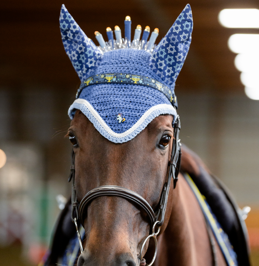 pinsnickety flying unicorn number pin on a horse's bonnet in the shape of a menorah for hanukkay