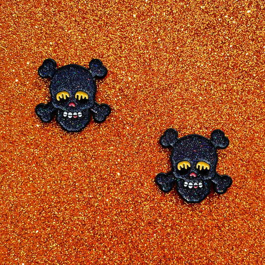 pinsnickety special edition black skull horse show number pins on an a sparkly orange background