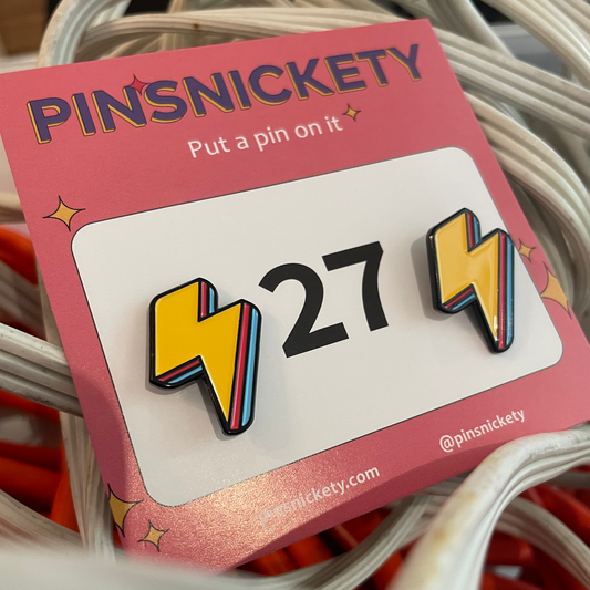 pinsnickety yellow lightning bolt horse show number pins in electric yellow in a bin of extension cords