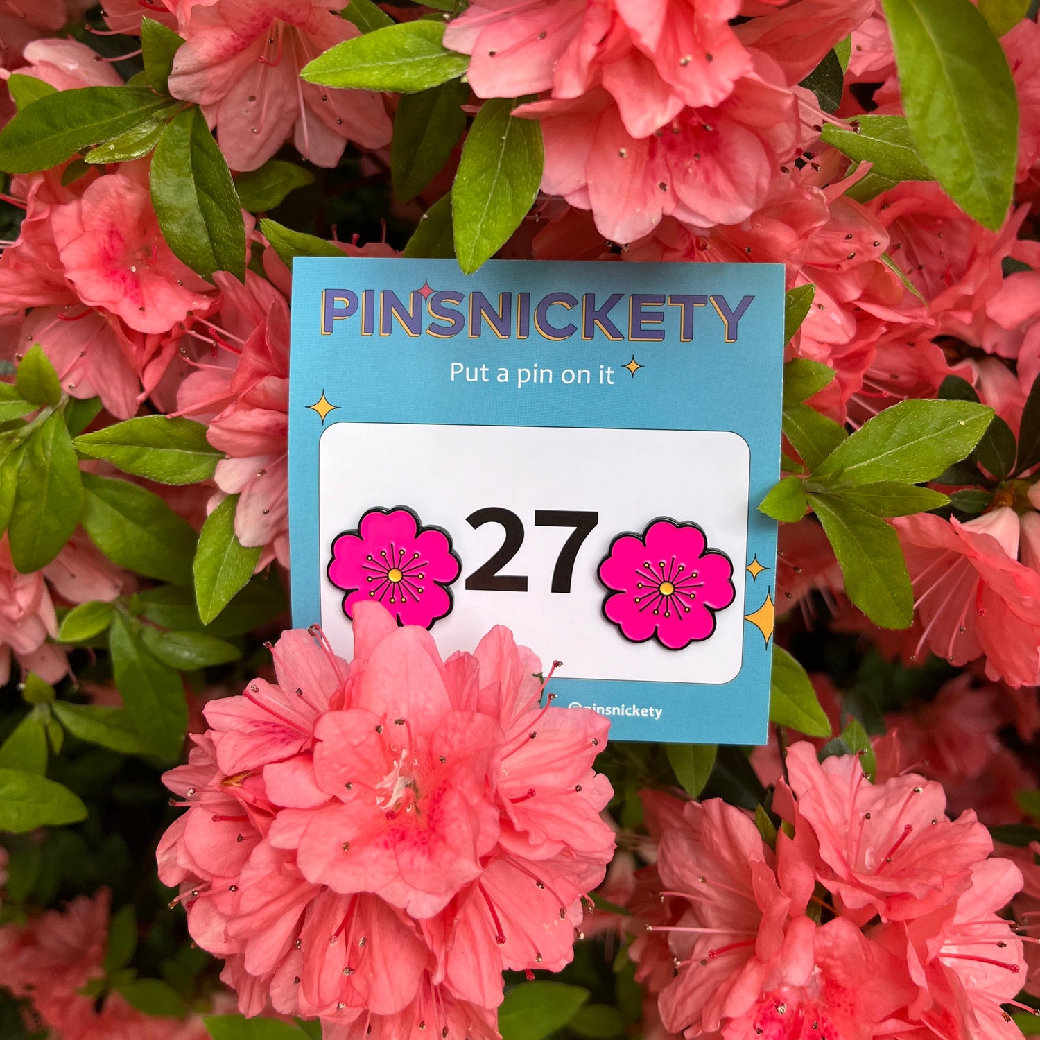 pinsnickety pink poppy horse show number pins in a bush with pink flowers