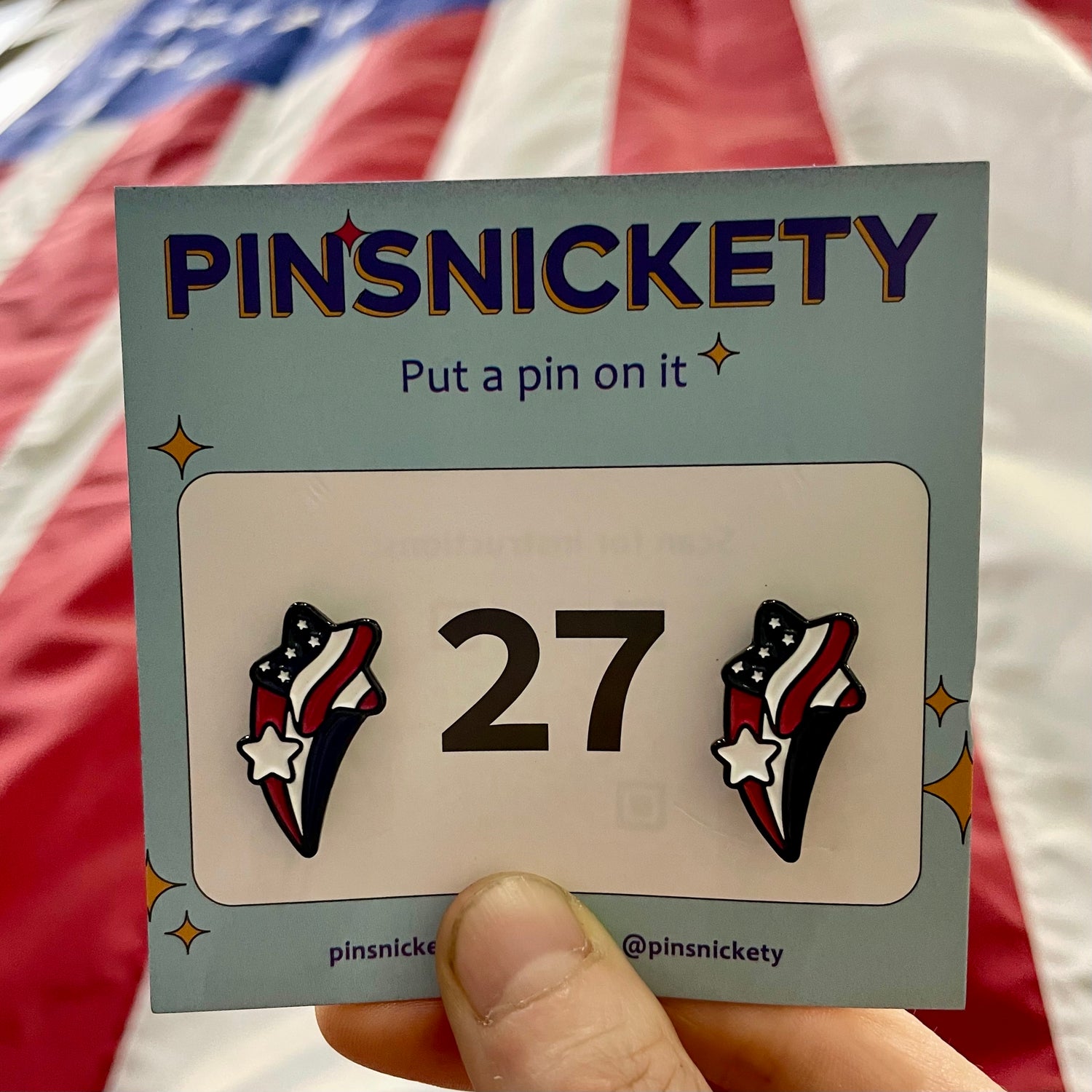 pinsnickety stars and stripes horse show number pins in front of an American flag