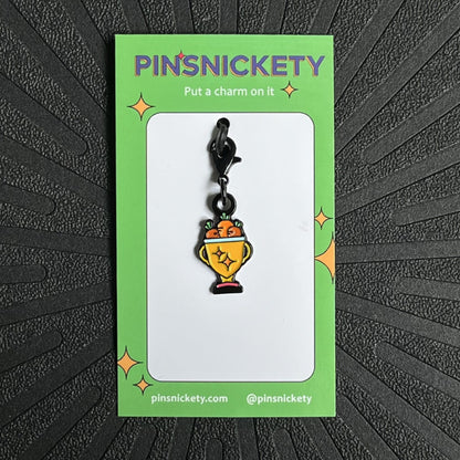 pinsnickety trophy bonnet charm on a black background
