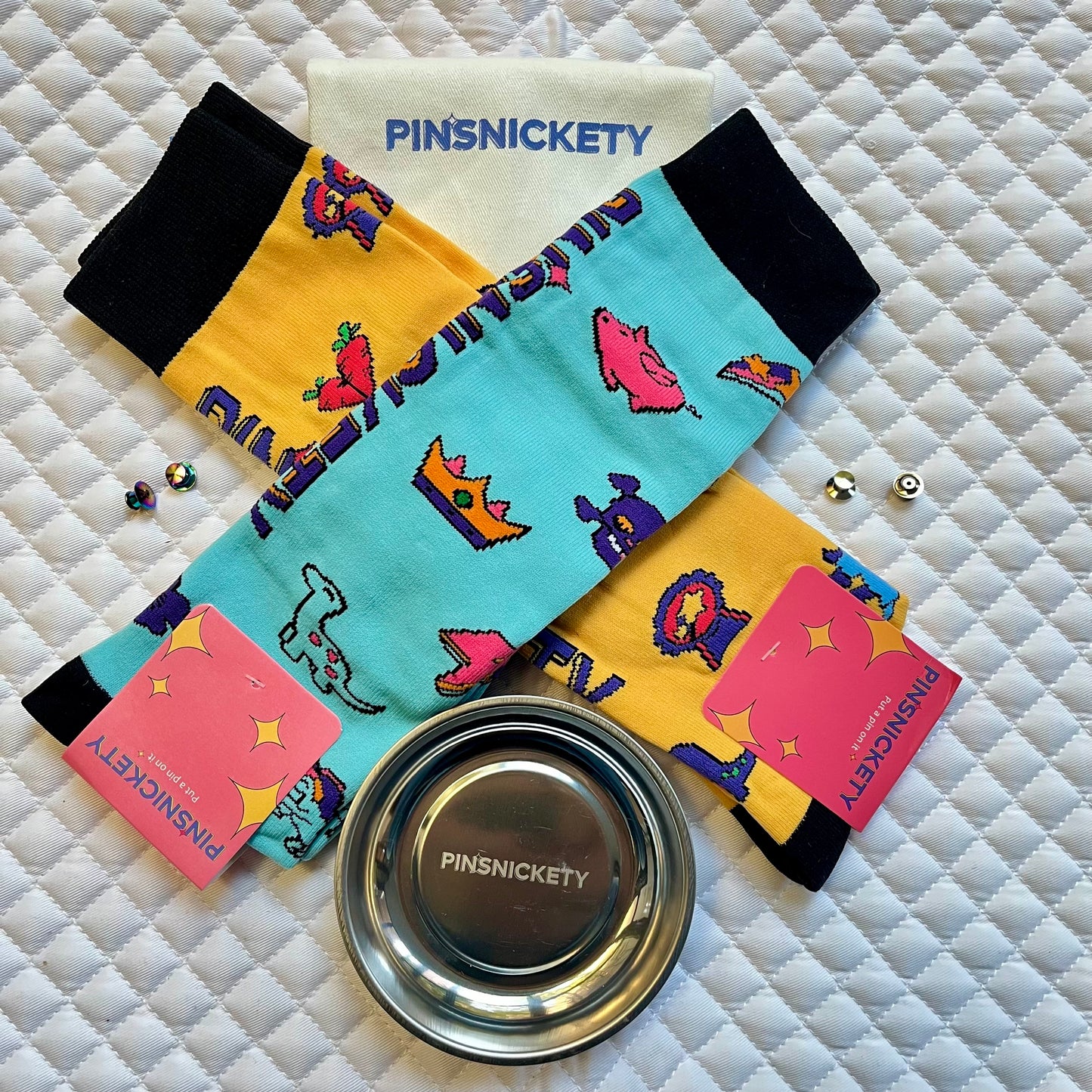 pinsnickety accessories gift pack, with two pairs of tall boot socks, a magnetic storage bowl, two pairs of extra locking clasps, and a twill storage bag