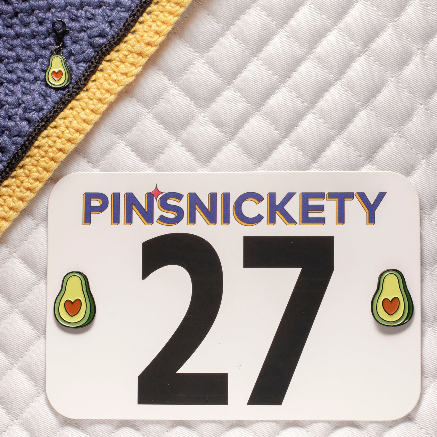 pinsnickety avocado bundle, featuring avocado horse show number pins on a saddle pad and  an avocado bridle charm on a bonnet