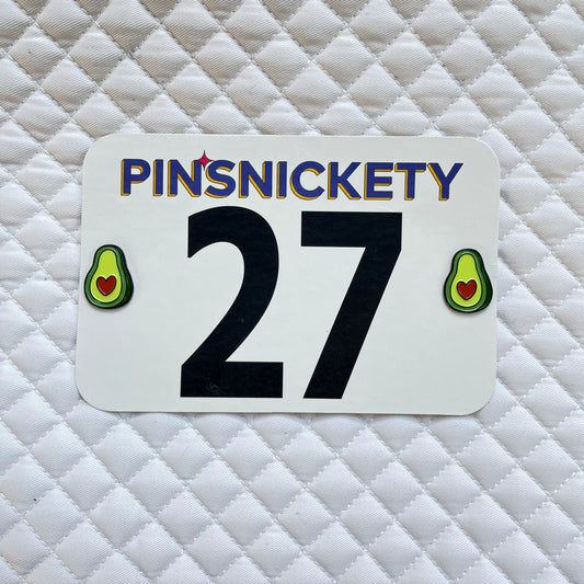 pinsnickety avocado horse show number pin on a saddle pad