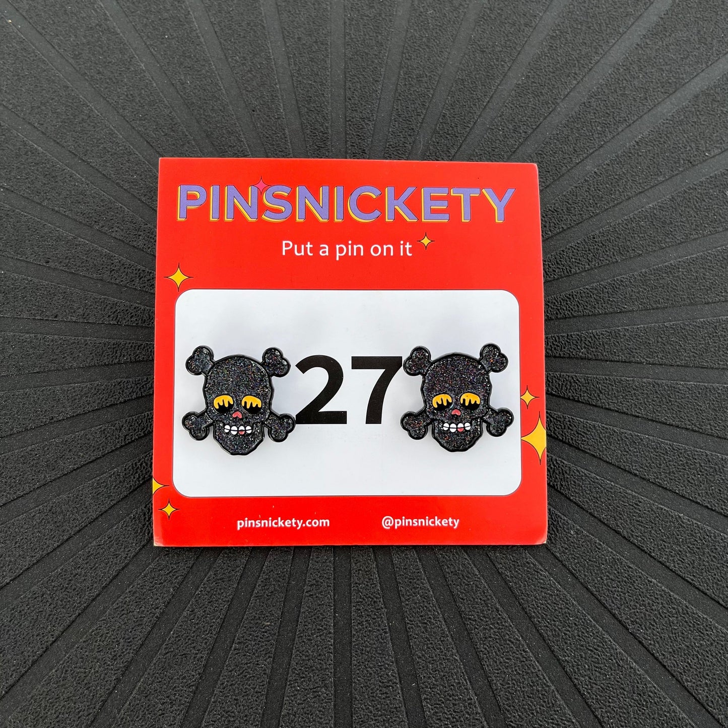 pinsnickety skull horse show number pin in special edition black on a black background and its product packaging card