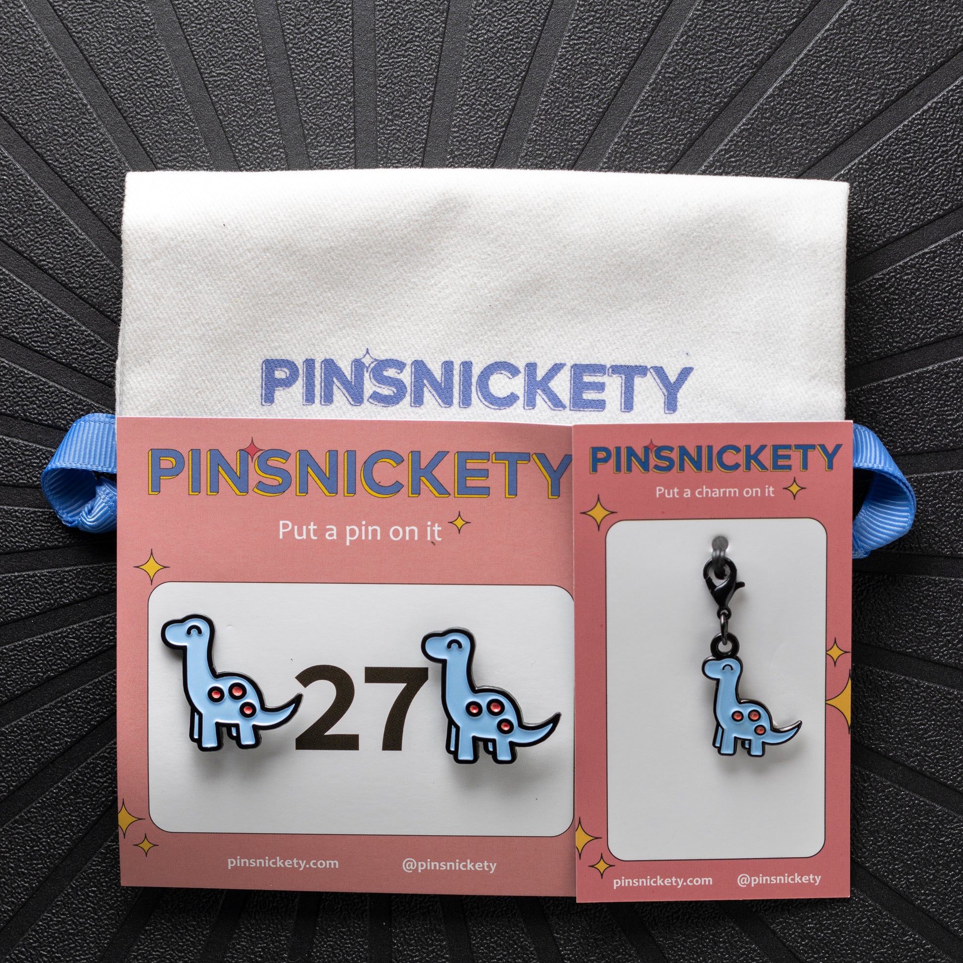 pinsnickety brontosaurus horse show number pins and braid and bridle charm with a pinsnickety twill bag as a matching set
