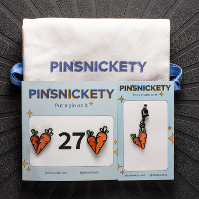 pinsnickety carrots matching set, featuring carrots horse show number pins, a carrots bridle charm and a pinsnickety twill bag