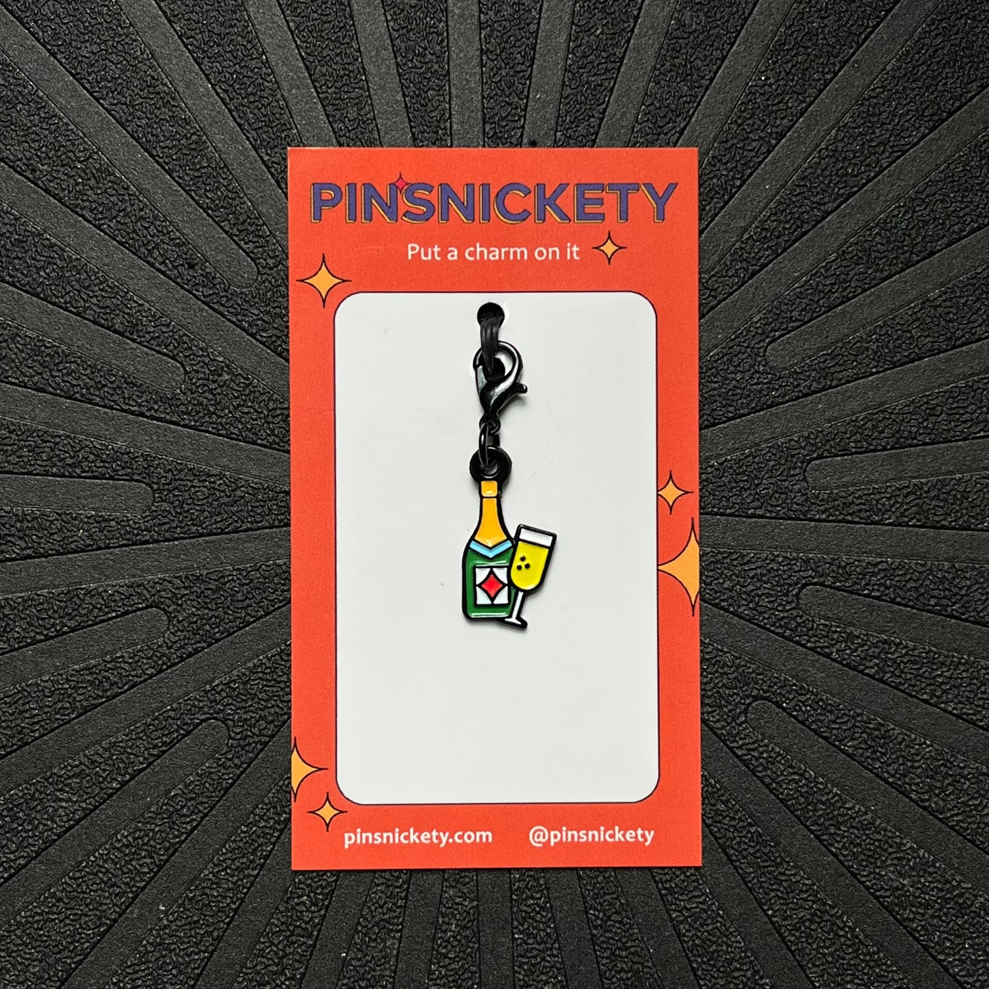 pinsnickety champagne braid and bridle charm on a black background