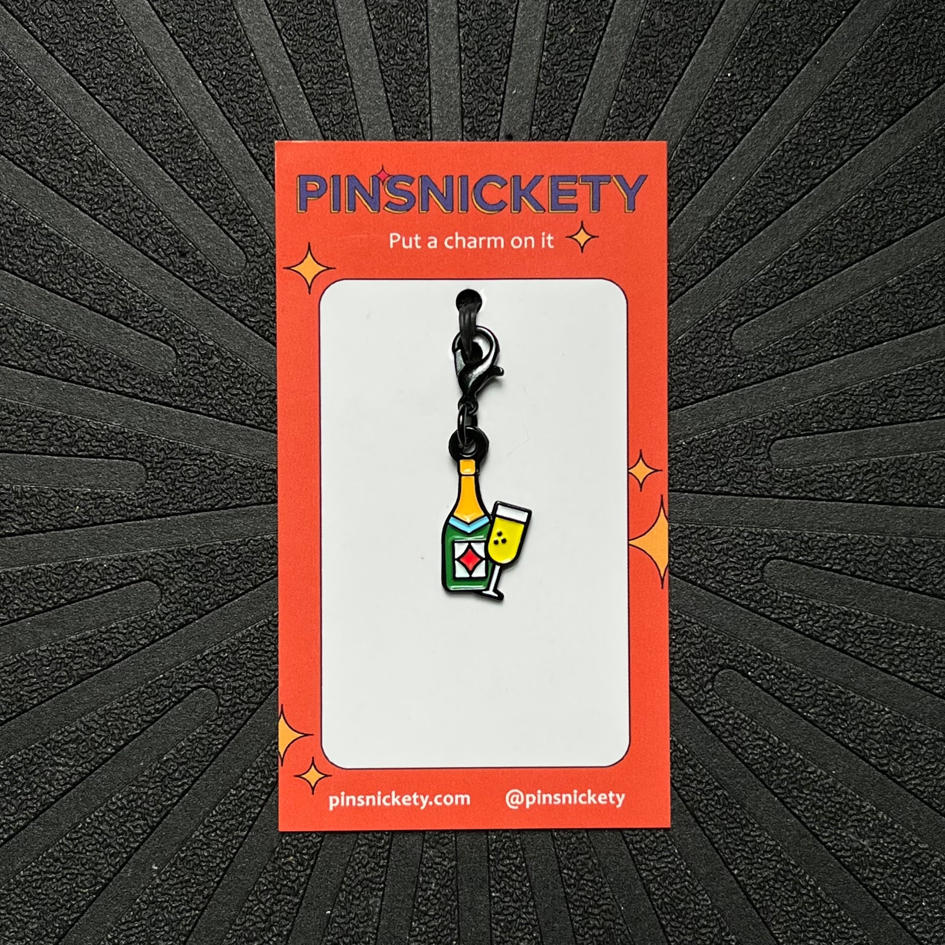 pinsnickety champagne braid and bridle charm on a black background