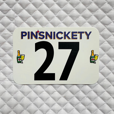 pinsnickety champagne horse show number pins on a saddle pad