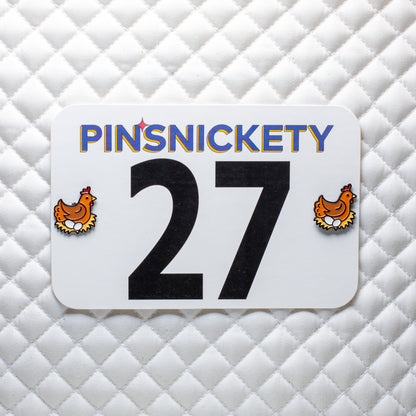 pinsnickety chicken horse show number pins on a saddle pad