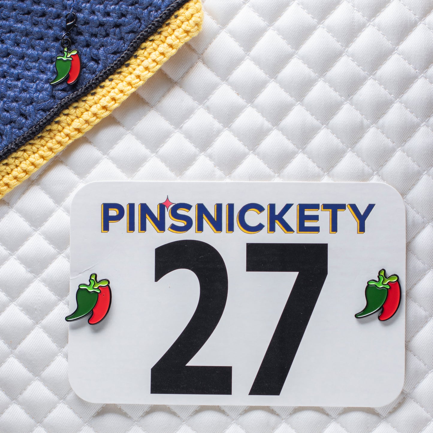 pinsnickety chili peppers set with braid and bridle charm on a bonnet and chili peppers horse show number pins on a saddle pad