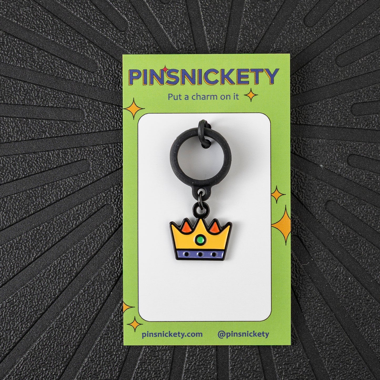 Pinsnickety Crown crop charm in front of a black background