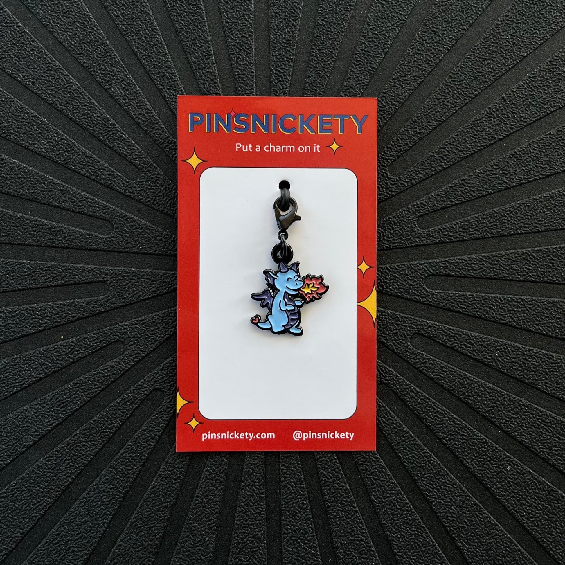 pinsnickety dragon braid and bridle charm on its product packaging card.