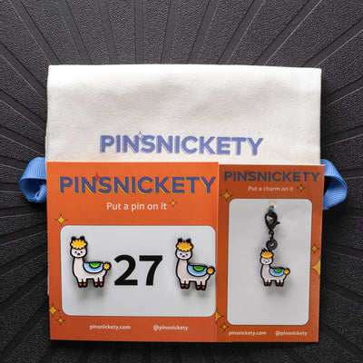 pinsnickety drama llama set with drama llama horse show number pins, drama llama braid and bridle charm, and a twill storage bag