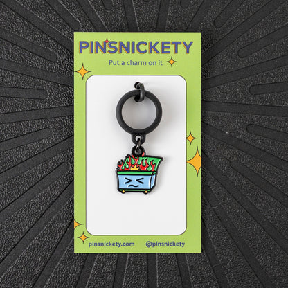 Pinsnickety Dumpster Fire crop charm in front of a black background