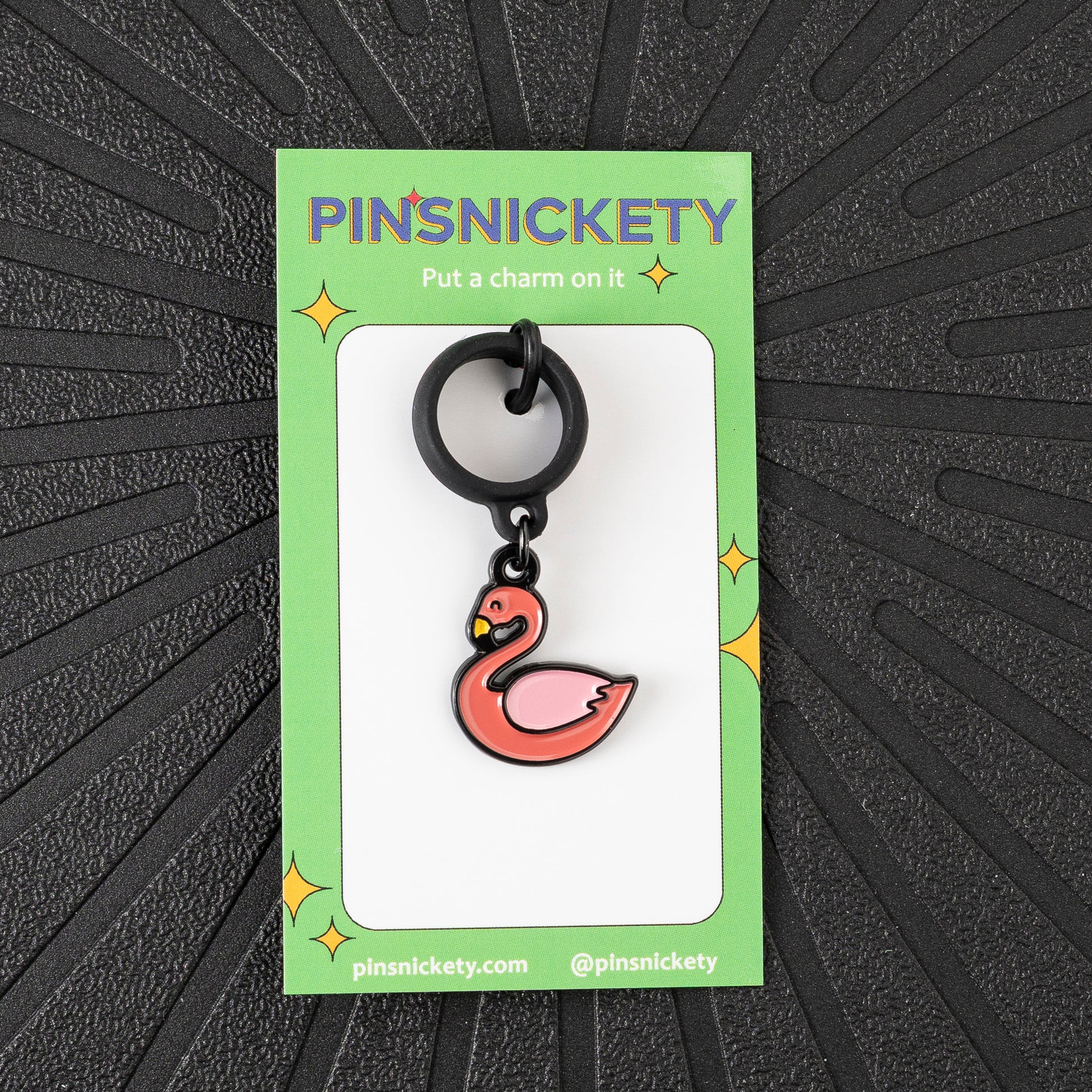 Pinsnickety Flamingo crop charm in front of a black background
