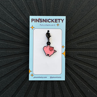 pinsnickety flying pig braid bridle and bonnet charm on a black background