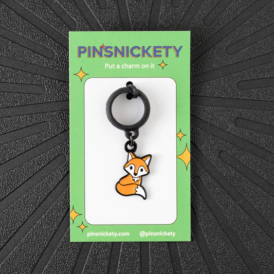 Pinsnickety Fox crop charm in front of a black background