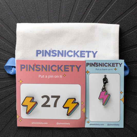 pinsnickety lightning bolt color combo set, with electric yellow horse show number pins and classic pink braid and bridle charm along with a twill storage bag