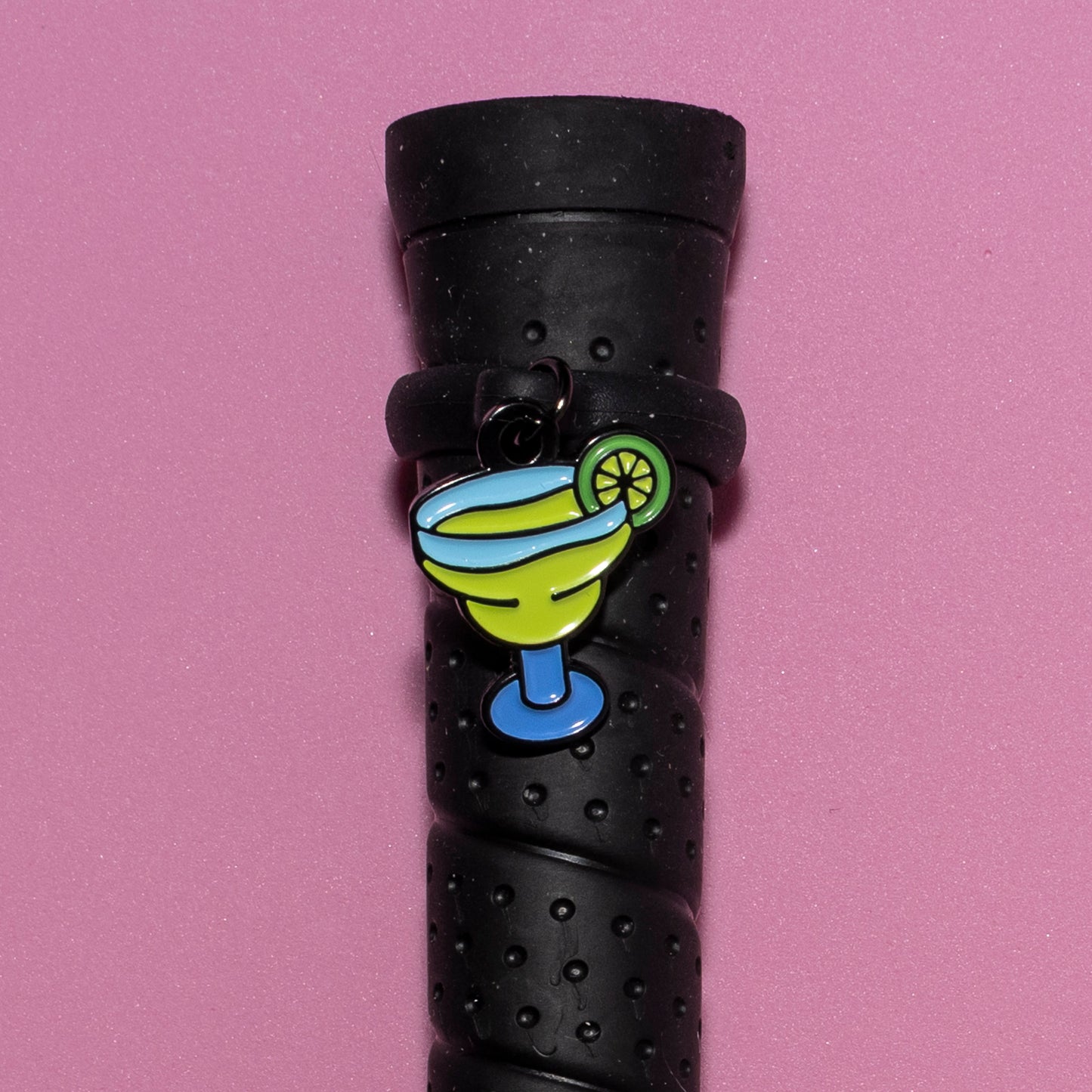 Pinsnickety Margarita crop charm on a whip handle in front of a colored background