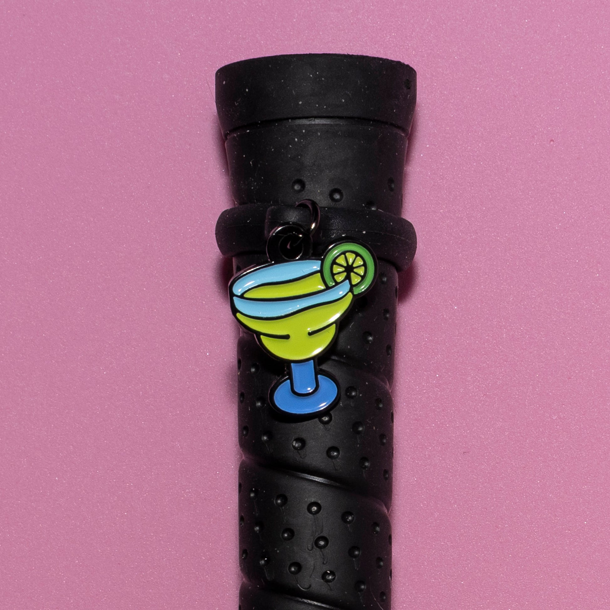 Pinsnickety Margarita crop charm on a whip handle in front of a colored background