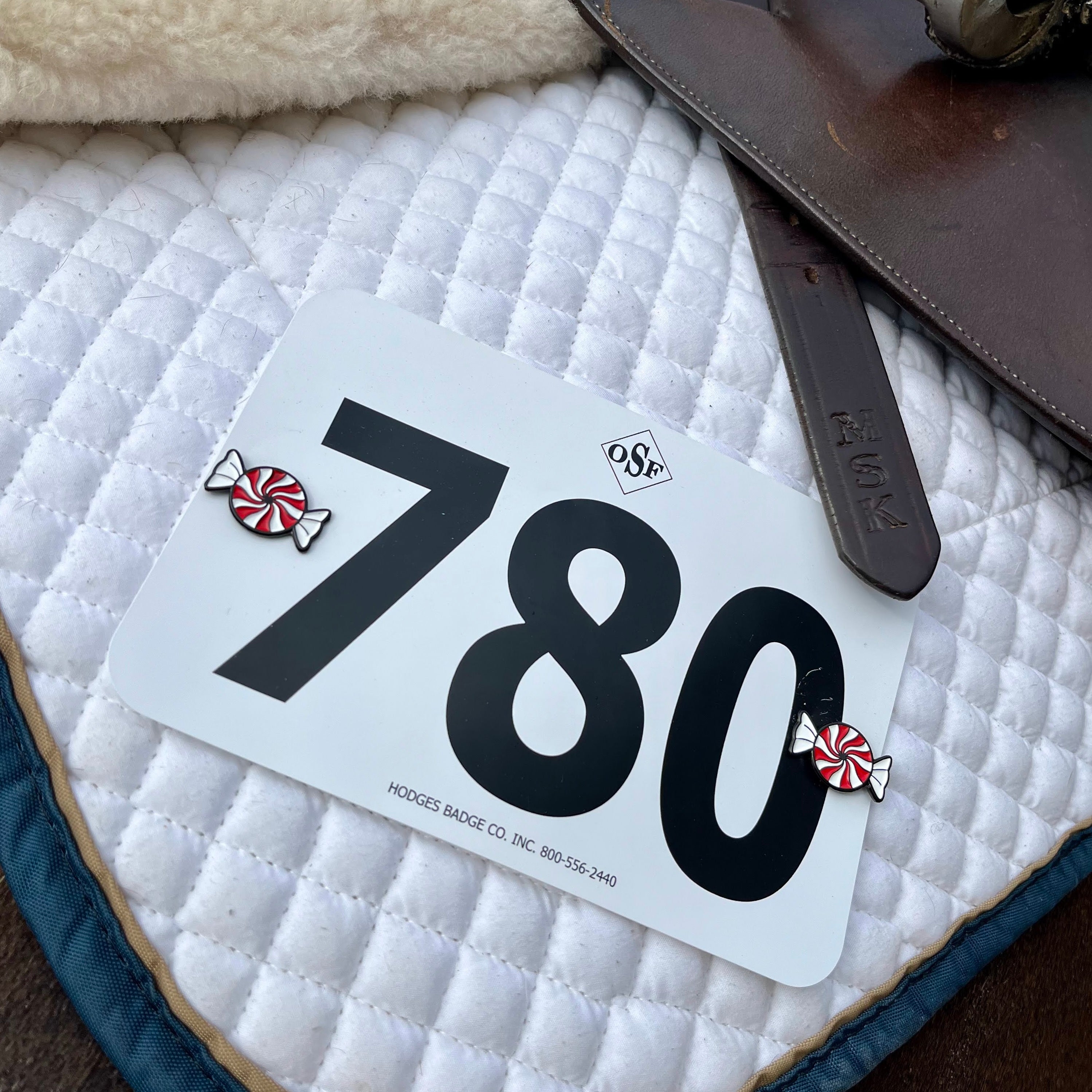 pinsnickety peppermint horse show number pins on a saddle pad