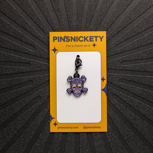 pinsnickety skull charm on a black background