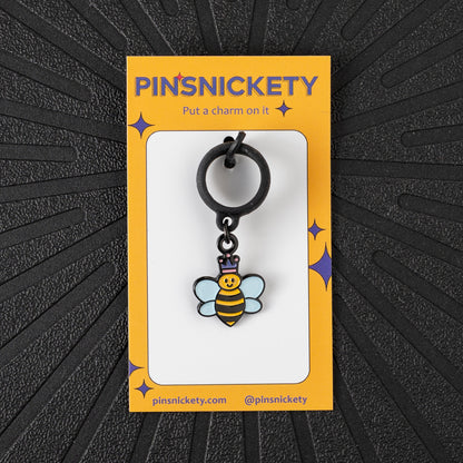 Pinsnickety Queen Bee crop charm in front of a black background