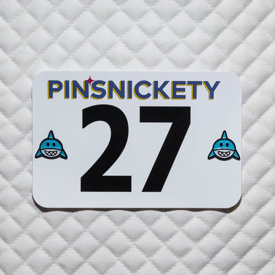 Pinsnickety shark horse show number pins on a white saddle pad