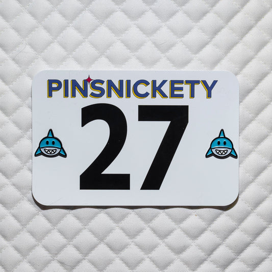 Pinsnickety shark horse show number pins on a white saddle pad