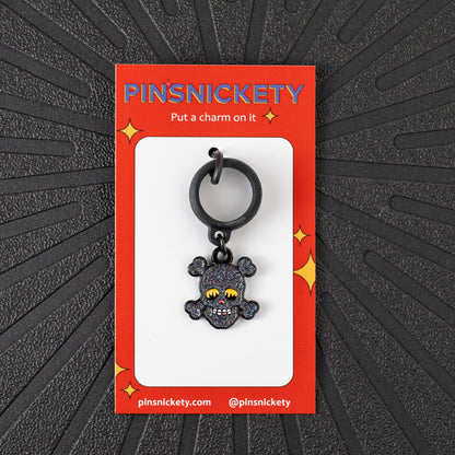 Pinsnickety Skull crop charm in front of a black background