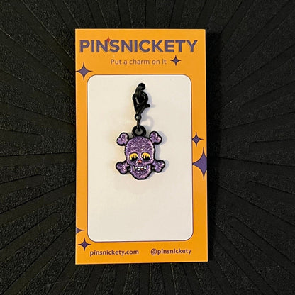 pinsnickety skull charm on a black background