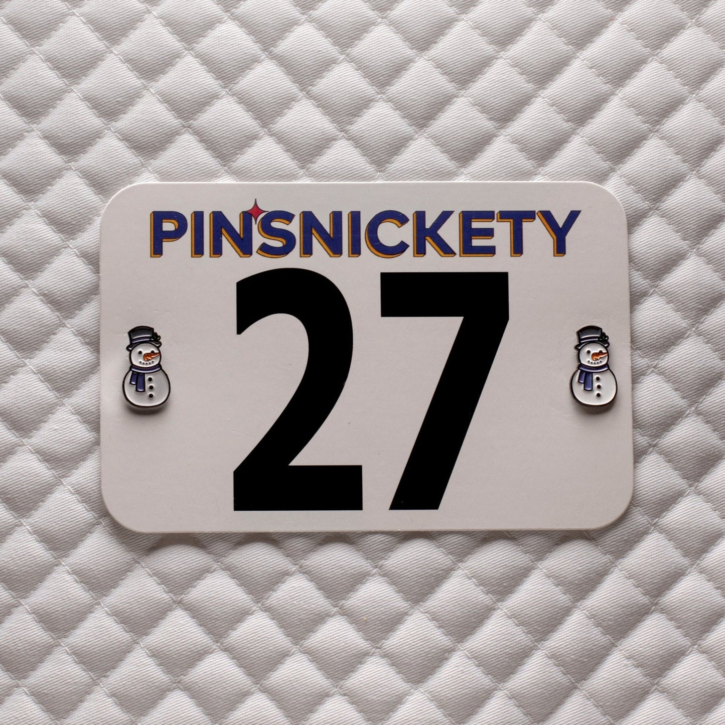 pinsnickety snowman horse show number pins on a saddle pad