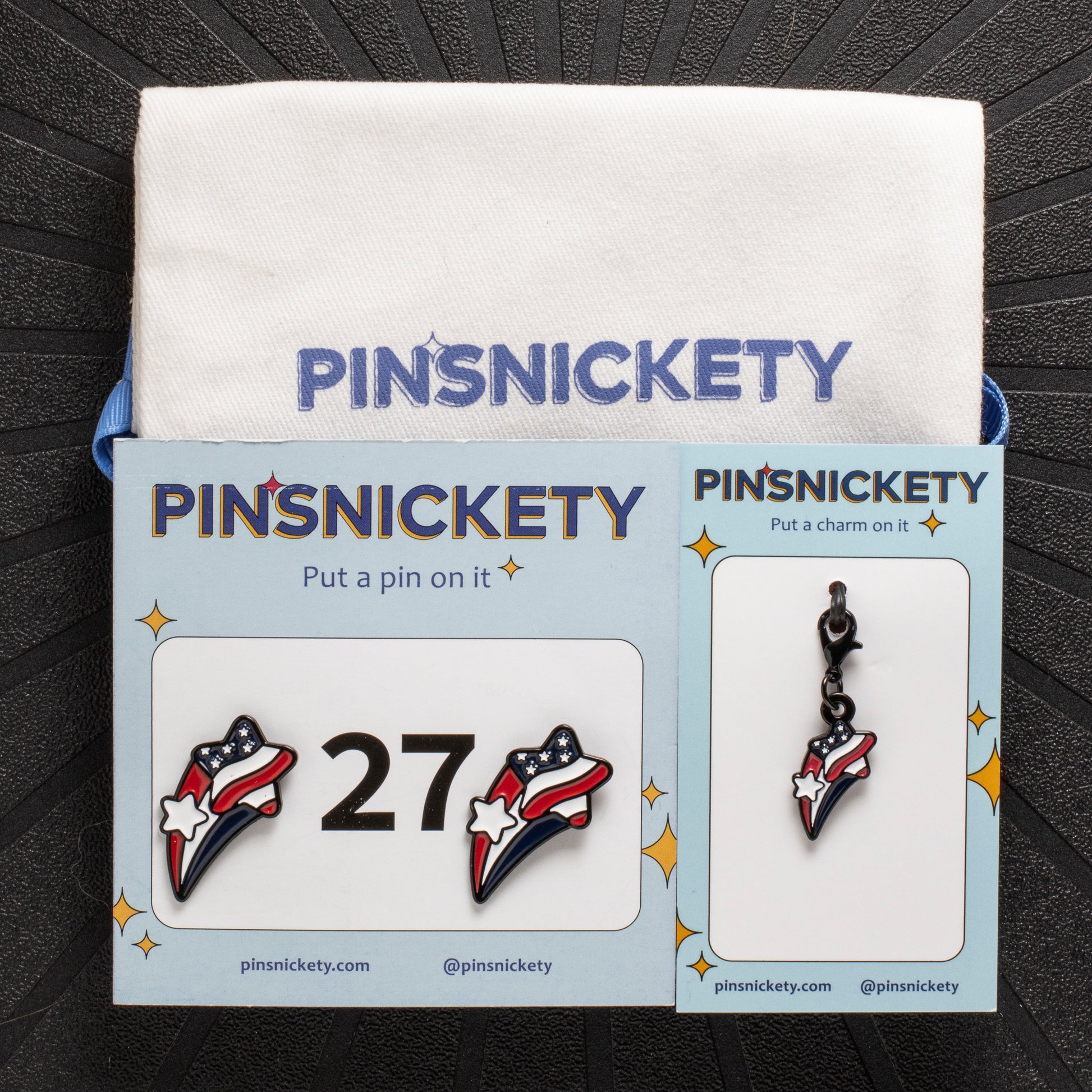 Pinsnickety stars and stripes set, including a stars and stripes american flag horse show number pin and a stars and stripes american flag bridle charm, with a twill storage bag