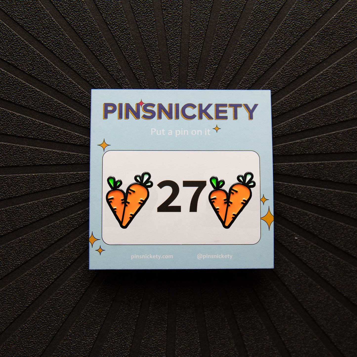 Pinsnickety Carrot horse show number pins on their product packaging card