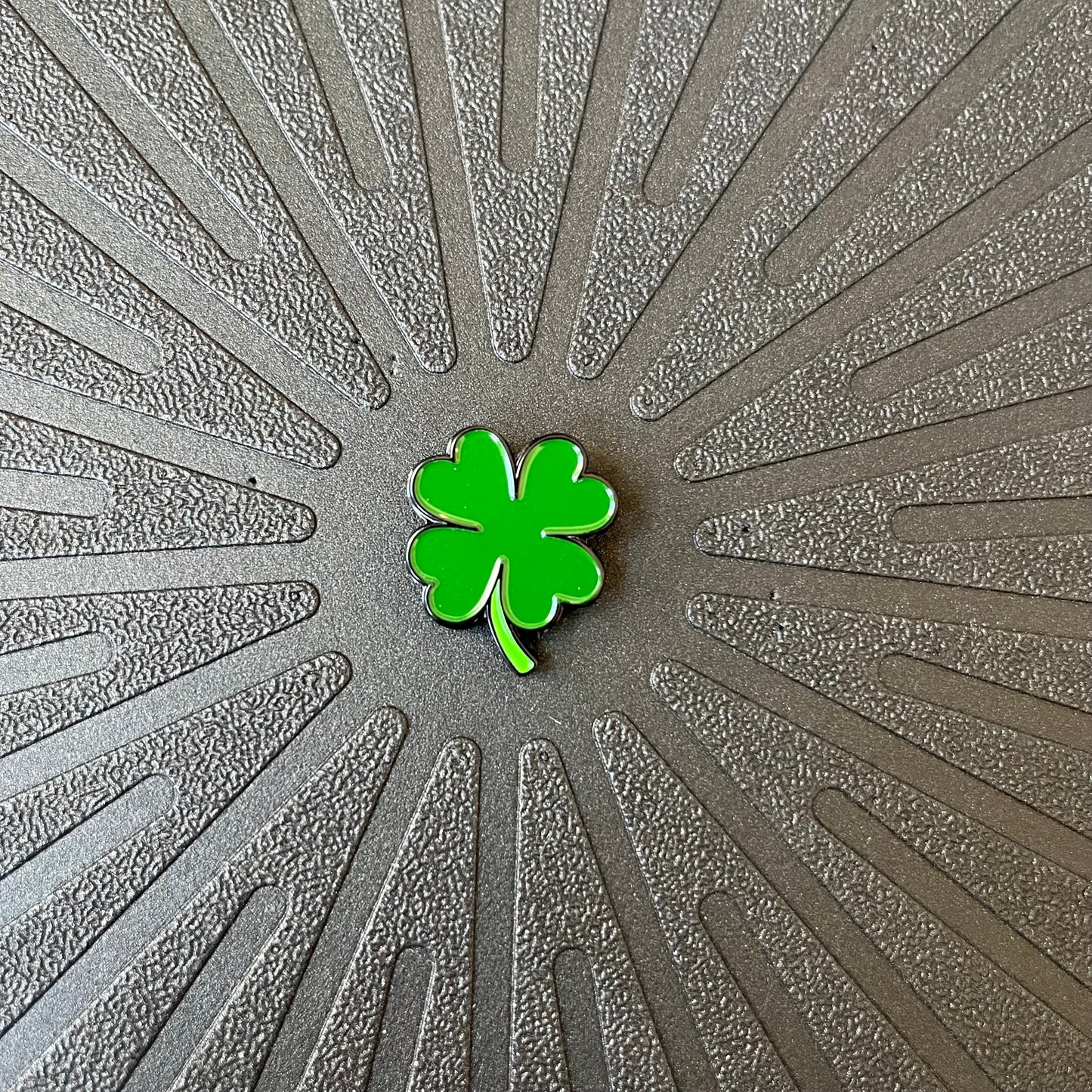 Close up view of Pinsnickety Clover horse show number pin.