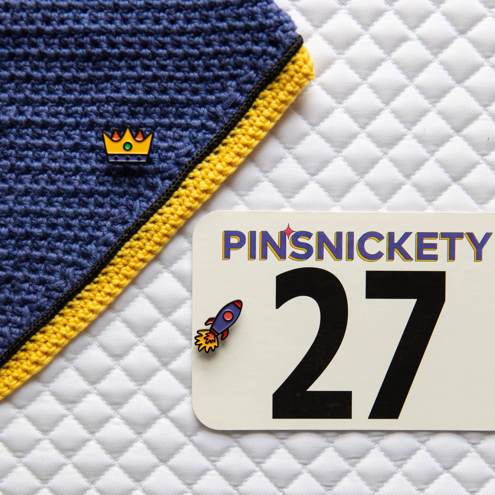 Pinsnickety's Rocket Ship pins paired with our Crown pin.
