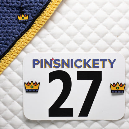 pinsnickety crown charm on a bonnet and crown horse show number pins on a saddle pad